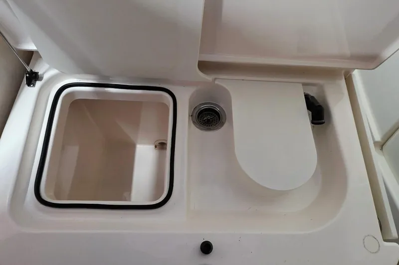  Yacht Photos Pics 2007 Tiara Yachts 3000 Open sink and storage compartment detail.