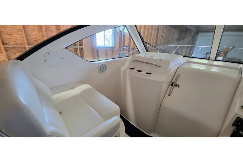  Yacht Photos Pics 2007 Tiara Yachts 3000 Open interior with white seating and helm station.