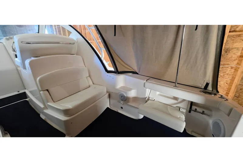  Yacht Photos Pics 2007 Tiara Yachts 3000 Open interior with white seating and covered windows.