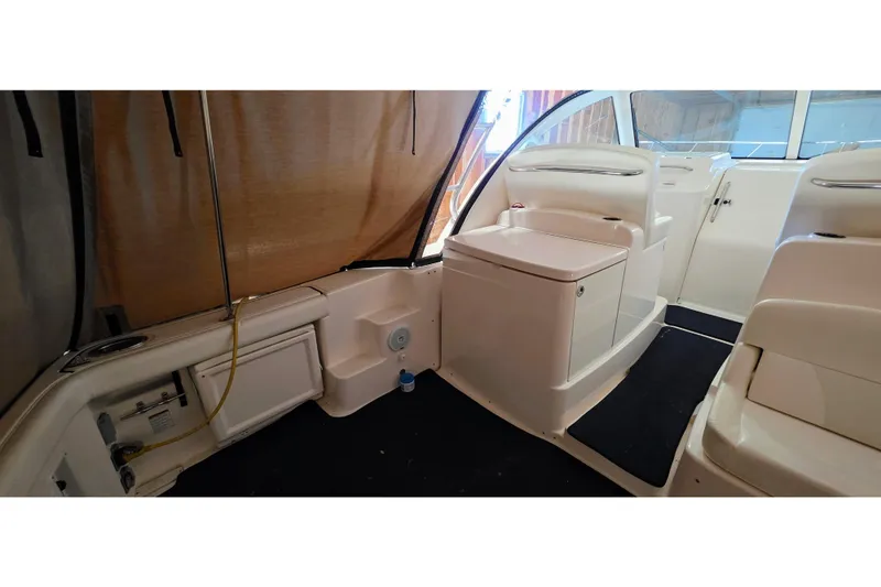  Yacht Photos Pics 2007 Tiara Yachts 3000 Open interior with seating and storage, featuring sleek design elements.