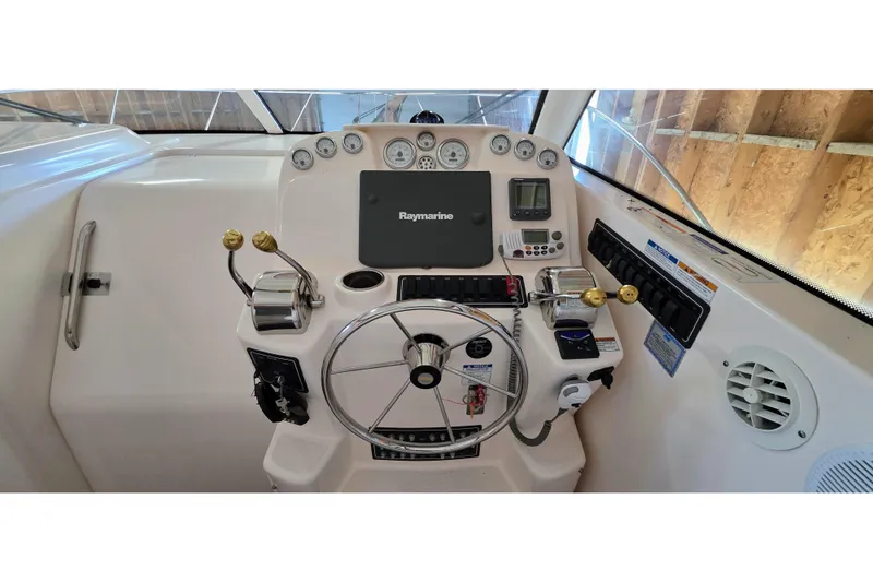  Yacht Photos Pics 2007 Tiara Yachts 3000 Open helm with Raymarine electronics and dual throttle controls.