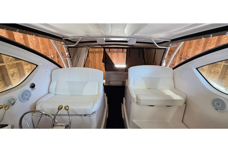  Yacht Photos Pics 2007 Tiara Yachts 3000 Open interior with white seating and helm station.