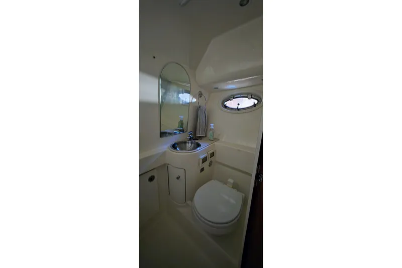  Yacht Photos Pics Bathroom interior of 2007 Tiara Yachts 3000 Open, featuring sink and toilet.