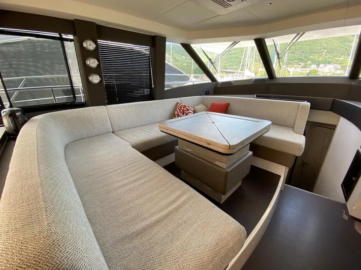 Mizar Yacht Photos Pics Luxurious interior of 2017 Azimut Magellano 53 yacht with elegant seating and table.