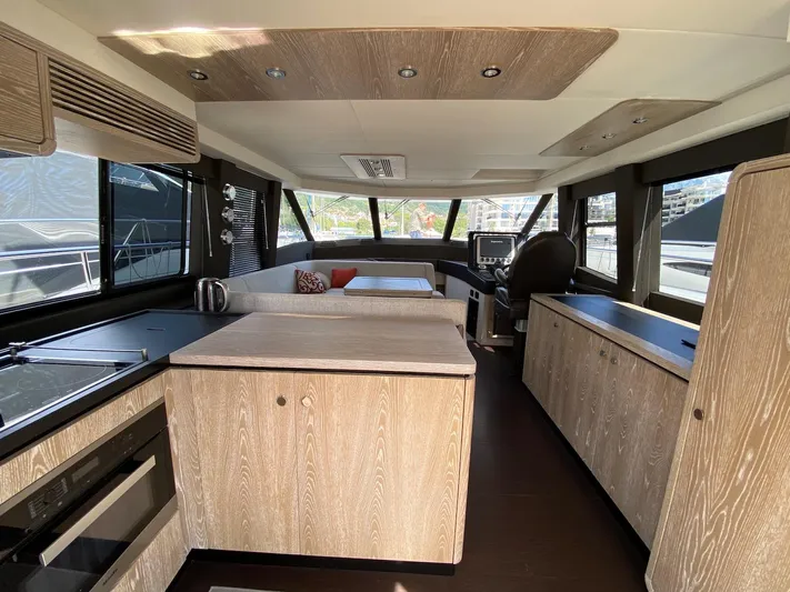 Mizar Yacht Photos Pics Interior of 2017 Azimut Magellano 53 yacht with modern wood finish and spacious layout.