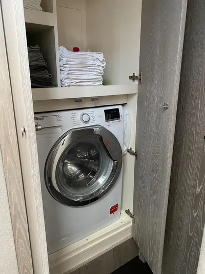 Mizar Yacht Photos Pics Laundry area with washing machine on 2017 Azimut Magellano 53 yacht.