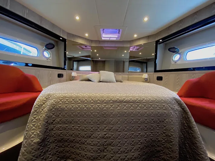 Mizar Yacht Photos Pics Luxurious interior of 2017 Azimut Magellano 53 yacht with elegant bedding and seating.