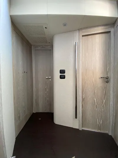 Mizar Yacht Photos Pics Interior hallway of 2017 Azimut Magellano 53 yacht with modern wood finish.