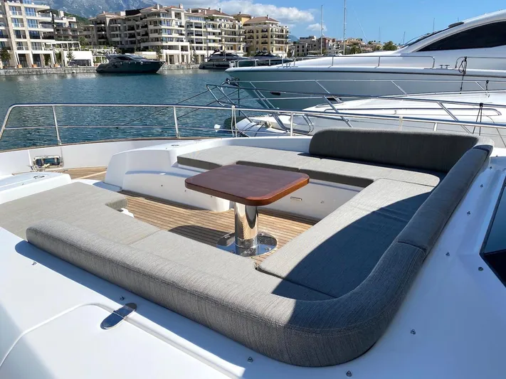 Mizar Yacht Photos Pics Luxurious 2017 Azimut Magellano 53 yacht with spacious deck seating and scenic marina view.