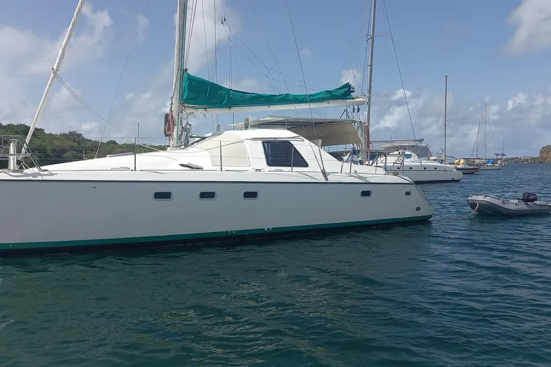 Yellowrock Yacht Photos Pics 1996 Alliaura Privilege 37 catamaran anchored in calm waters under a clear sky.