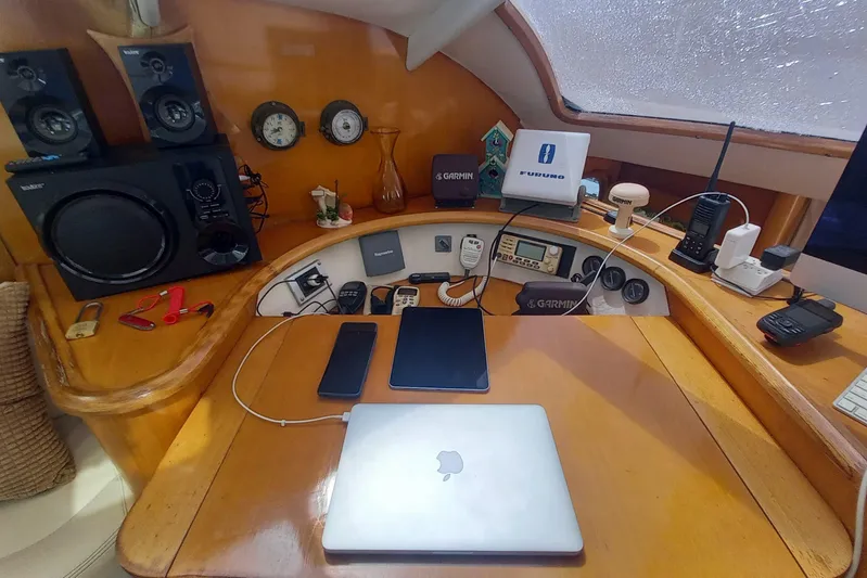 Yellowrock Yacht Photos Pics Navigation station on 1996 Alliaura Privilege 37 catamaran with electronics and communication devices.