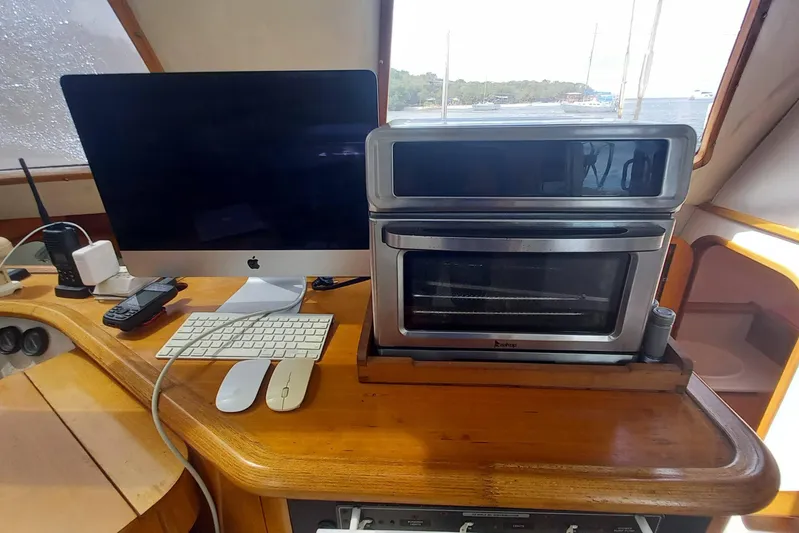 Yellowrock Yacht Photos Pics Interior of 1996 Alliaura Privilege 37 with computer and oven on wooden counter.