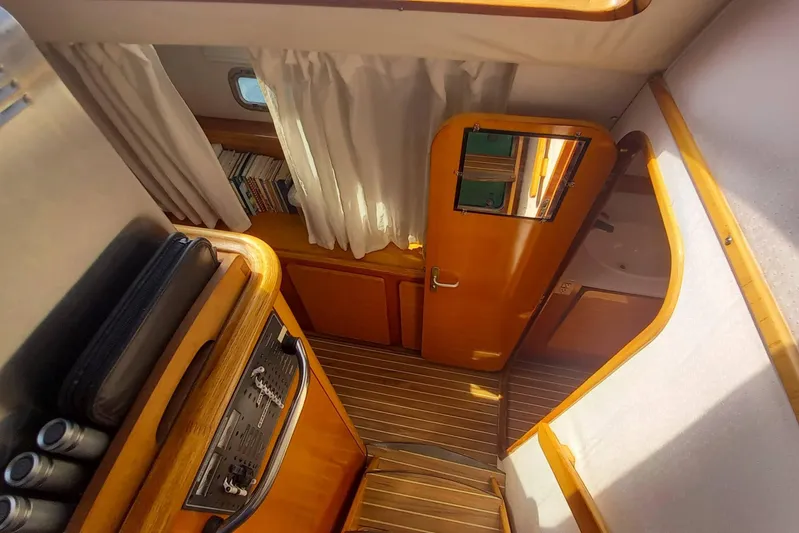 Yellowrock Yacht Photos Pics Interior of 1996 Alliaura Privilege 37 yacht with wooden finishes and striped flooring.