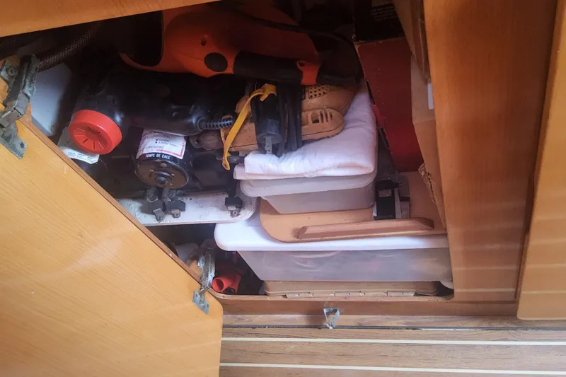 Yellowrock Yacht Photos Pics Storage compartment inside a 1996 Alliaura Privilege 37 yacht, containing tools and equipment.