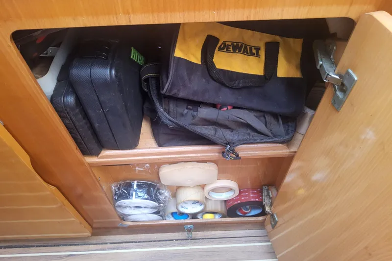 Yellowrock Yacht Photos Pics Storage cabinet on 1996 Alliaura Privilege 37 with tools and supplies.
