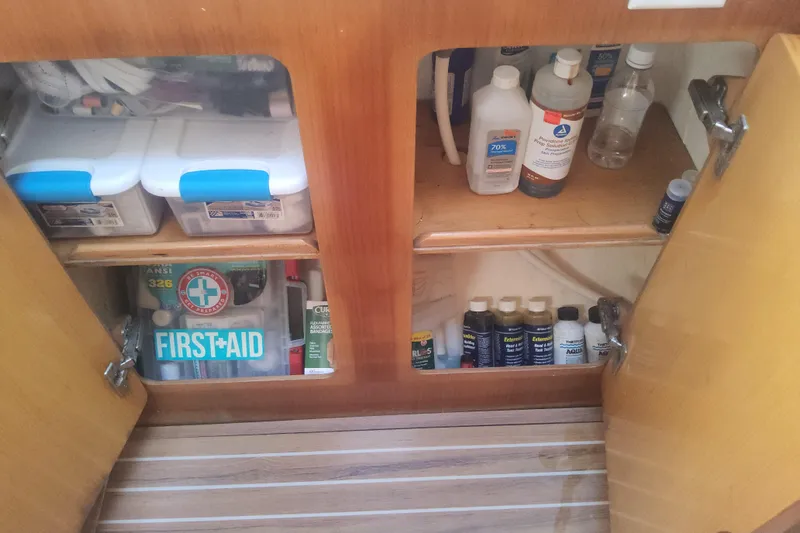 Yellowrock Yacht Photos Pics Cabinet with first aid supplies and cleaning products on a 1996 Alliaura Privilege 37 yacht.