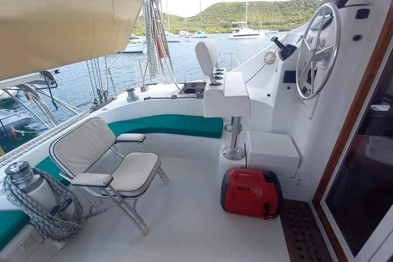 Yellowrock Yacht Photos Pics Cockpit of 1996 Alliaura Privilege 37 catamaran with seating and steering wheel.