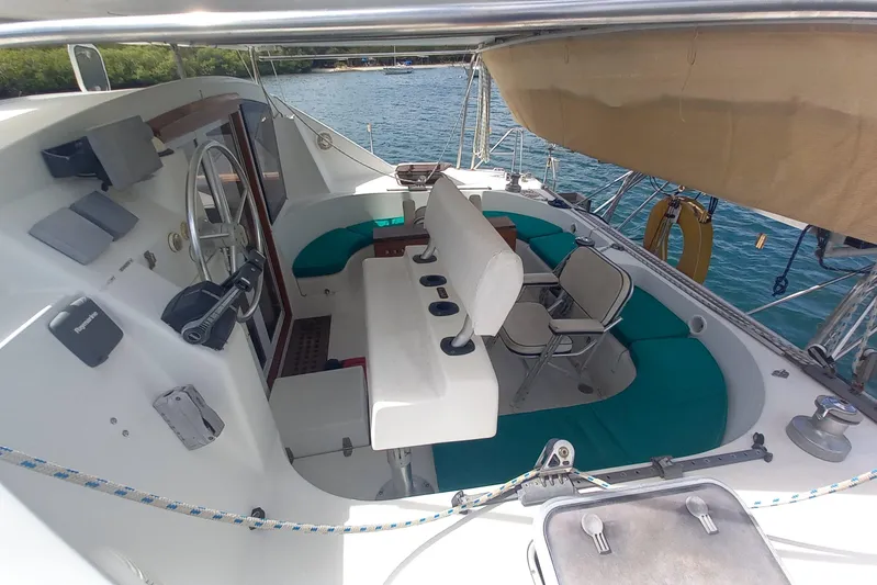 Yellowrock Yacht Photos Pics 1996 Alliaura Privilege 37 yacht cockpit with seating, steering wheel, and ocean view.