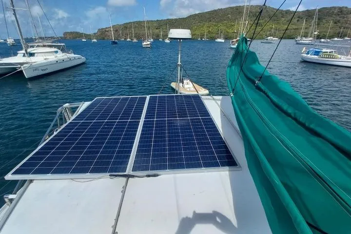 Yellowrock Yacht Photos Pics Solar panels on 1996 Alliaura Privilege 37 catamaran, anchored in scenic bay with sailboats.