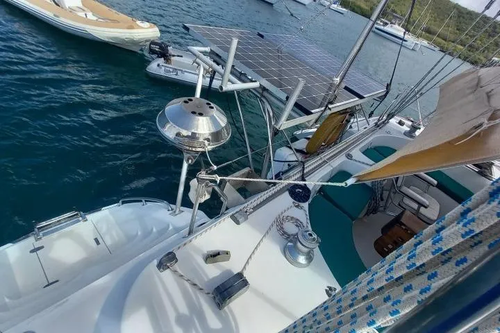 Yellowrock Yacht Photos Pics 1996 Alliaura Privilege 37 catamaran with solar panels and outdoor seating on the water.