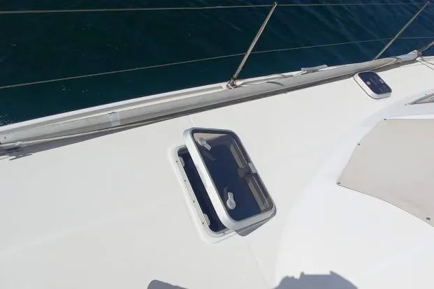 Yellowrock Yacht Photos Pics 1996 Alliaura Privilege 37 yacht deck with open hatch, showing sleek design.