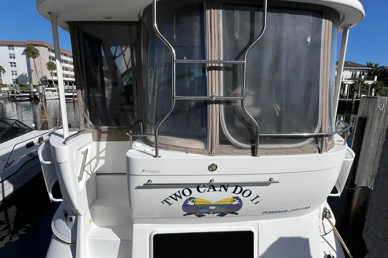 Two Can Do It II Yacht Photos Pics 2000 Cruisers Yachts 4450 Motor Yacht docked, featuring "Two Can Do II" name on the stern.