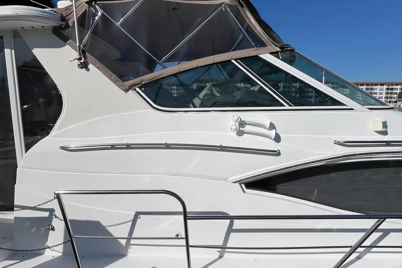 Two Can Do It II Yacht Photos Pics 2000 Cruisers Yachts 4450 Motor Yacht side view with clear blue sky background.