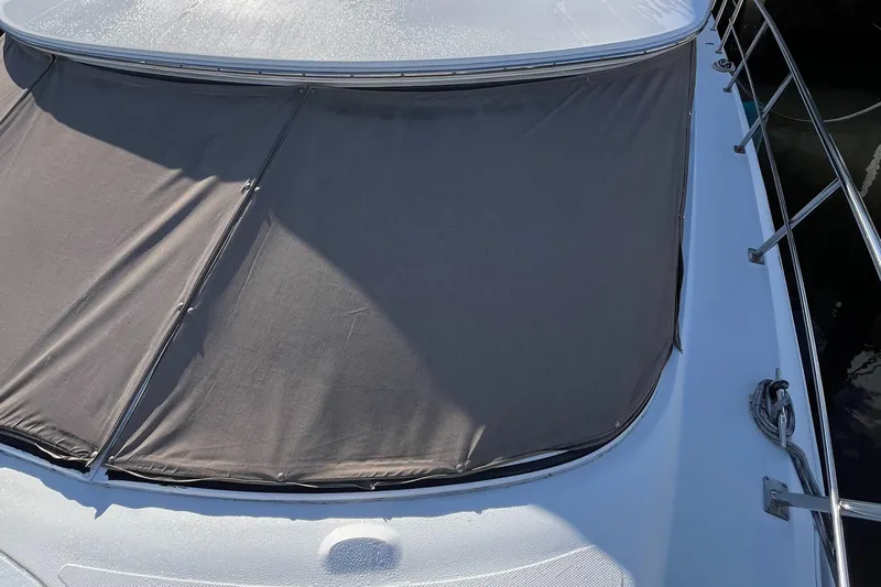 Two Can Do It II Yacht Photos Pics 2000 Cruisers Yachts 4450 Motor Yacht with sunshade cover on deck.