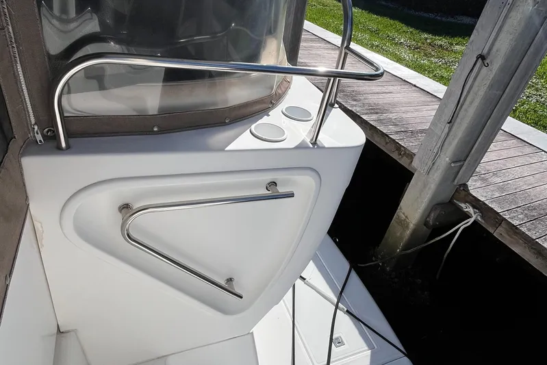 Two Can Do It II Yacht Photos Pics 2000 Cruisers Yachts 4450 Motor Yacht deck with stainless steel railing and cup holders.