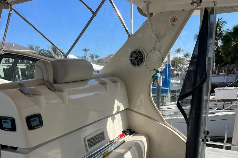 Two Can Do It II Yacht Photos Pics Interior of 2000 Cruisers Yachts 4450 Motor Yacht with seating and marina view.