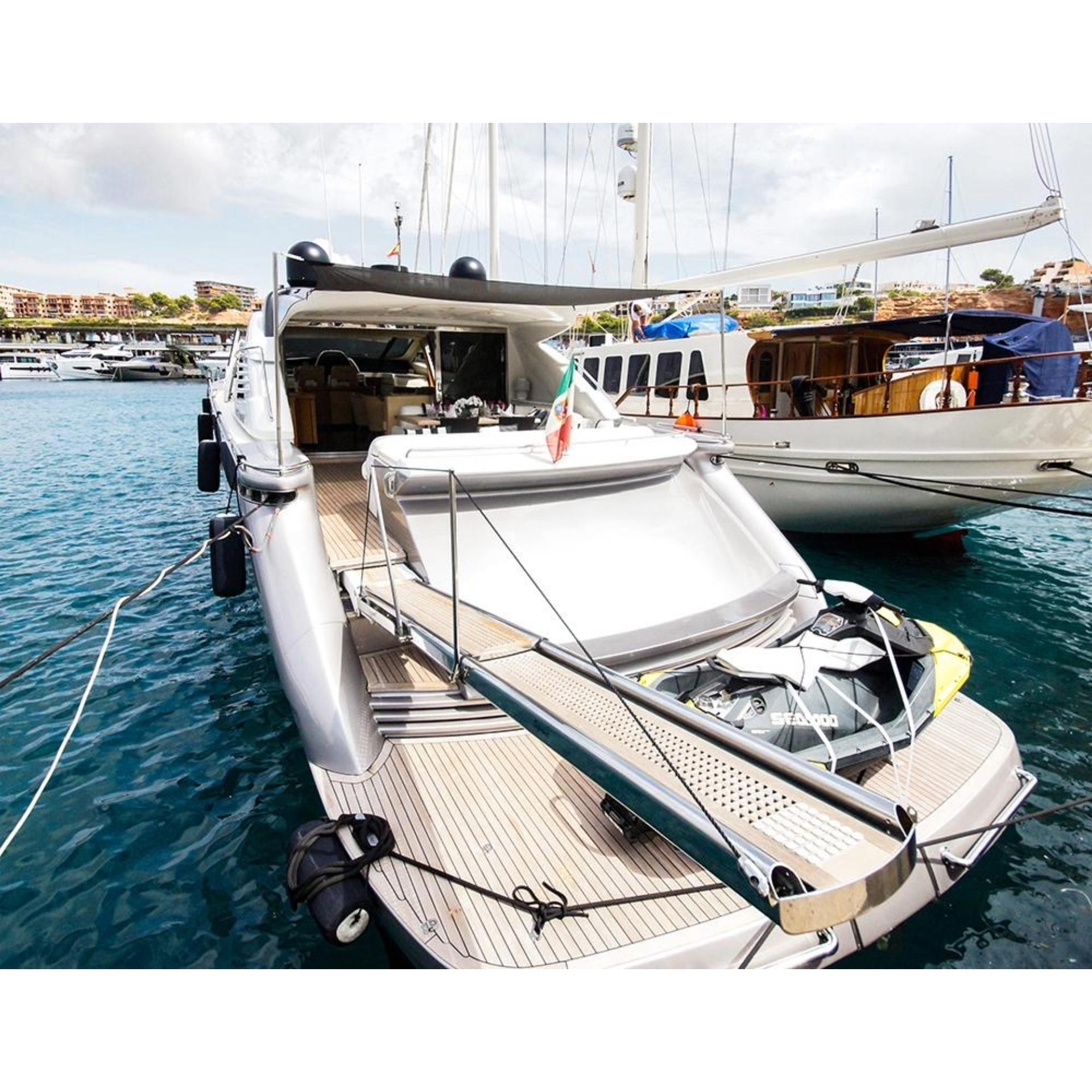 Luxury 2005 Pershing 76 yacht docked in marina, featuring sleek design and spacious deck.