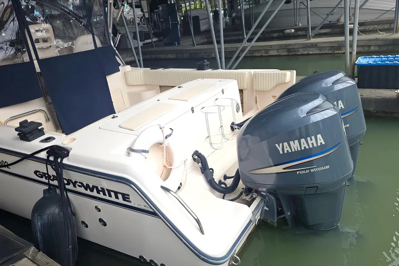  Yacht Photos Pics 2007 Grady-White Express 305 boat with twin Yamaha four-stroke engines docked in marina.