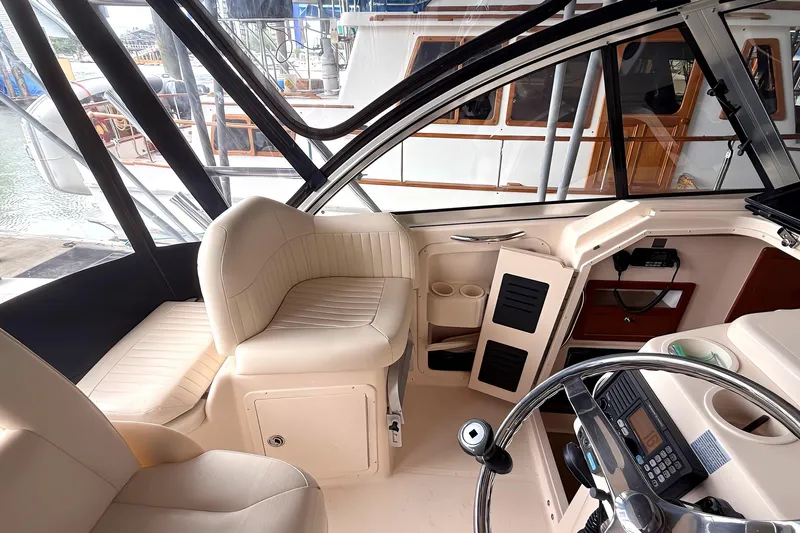  Yacht Photos Pics 2007 Grady-White Express 305 boat interior with helm, seating, and controls.