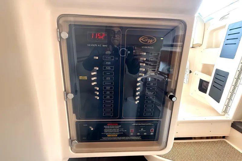 Yacht Photos Pics Electrical panel on 2007 Grady-White Express 305 boat, displaying voltage and circuit breakers.