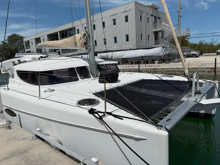 Brake Aweigh Yacht Photos Pics 2014 Fountaine Pajot Mahe 36 Evolution catamaran docked, featuring sleek design and spacious deck.
