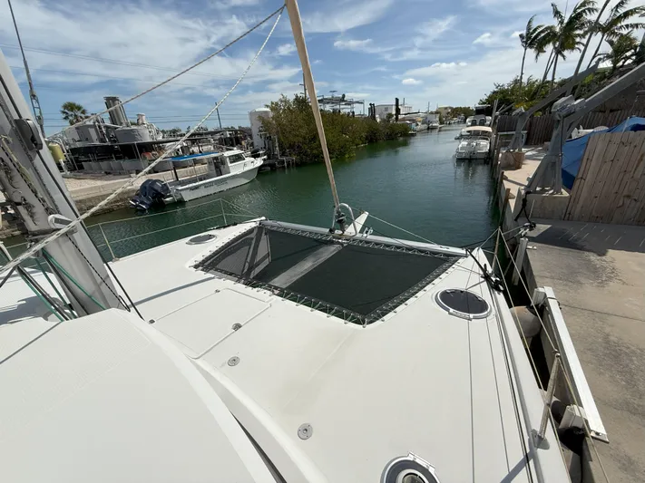 Brake Aweigh Yacht Photos Pics 2014 Fountaine Pajot Mahe 36 Evolution catamaran docked in a serene marina setting.