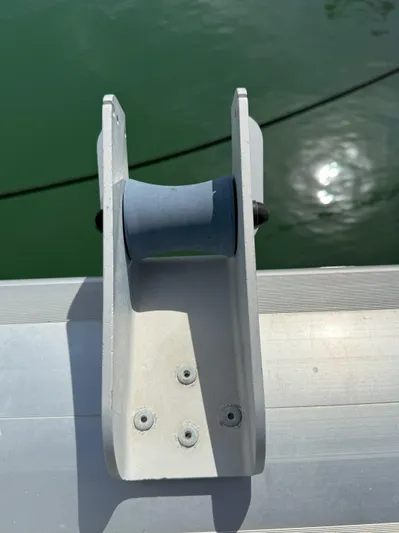 Brake Aweigh Yacht Photos Pics Deck fitting on 2014 Fountaine Pajot Mahe 36 Evolution catamaran, near water.