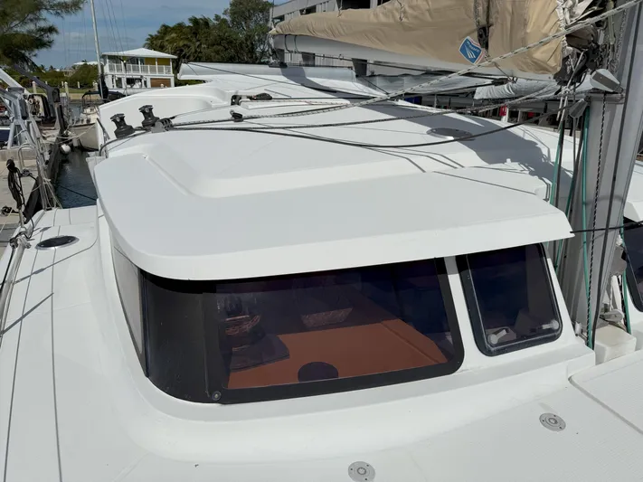 Brake Aweigh Yacht Photos Pics 2014 Fountaine Pajot Mahe 36 Evolution catamaran, docked, showcasing sleek design and spacious deck.