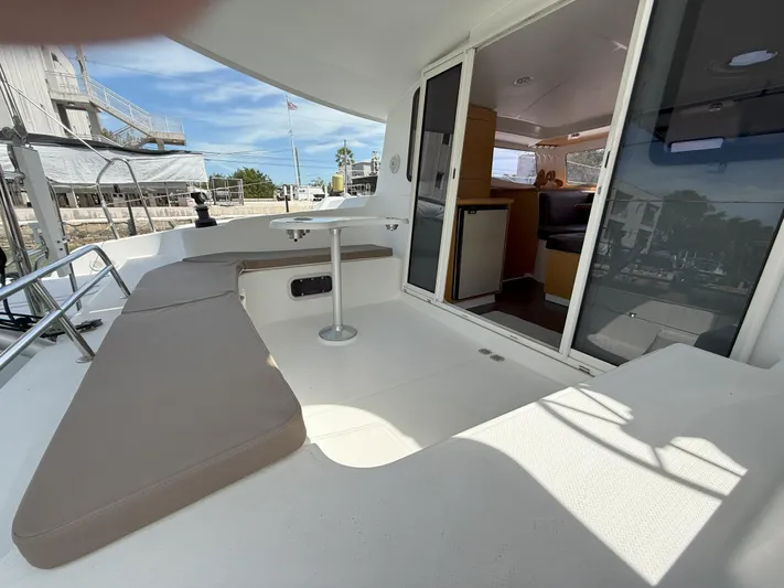 Brake Aweigh Yacht Photos Pics 2014 Fountaine Pajot Mahe 36 Evolution yacht with spacious outdoor seating and interior view.