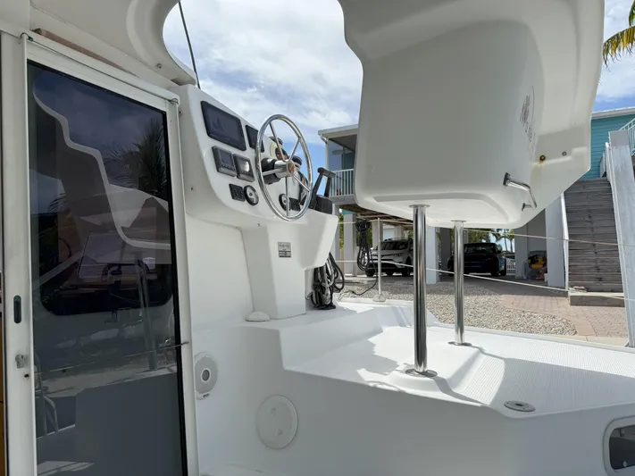 Brake Aweigh Yacht Photos Pics 2014 Fountaine Pajot Mahe 36 Evolution cockpit with steering wheel and navigation controls.