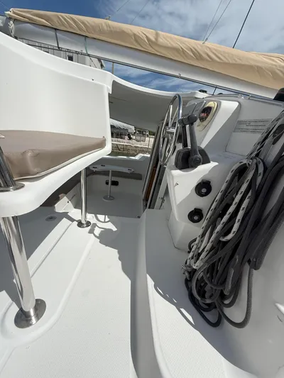 Brake Aweigh Yacht Photos Pics 2014 Fountaine Pajot Mahe 36 Evolution yacht cockpit with steering wheel and ropes.