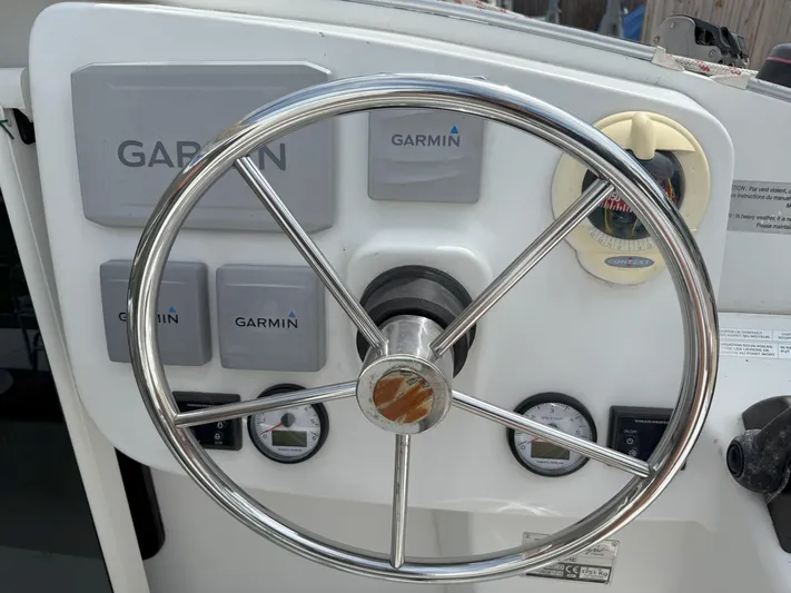 Brake Aweigh Yacht Photos Pics Steering wheel and Garmin controls on 2014 Fountaine Pajot Mahe 36 Evolution yacht.