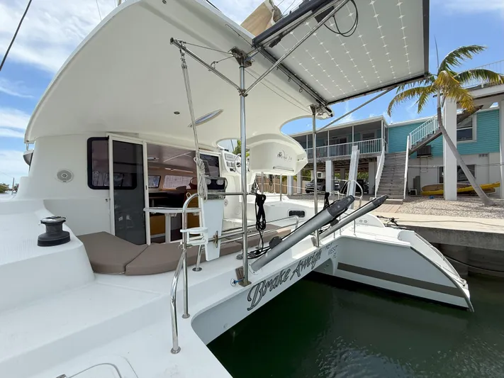 Brake Aweigh Yacht Photos Pics 2014 Fountaine Pajot Mahe 36 Evolution catamaran docked, featuring spacious deck and modern design.