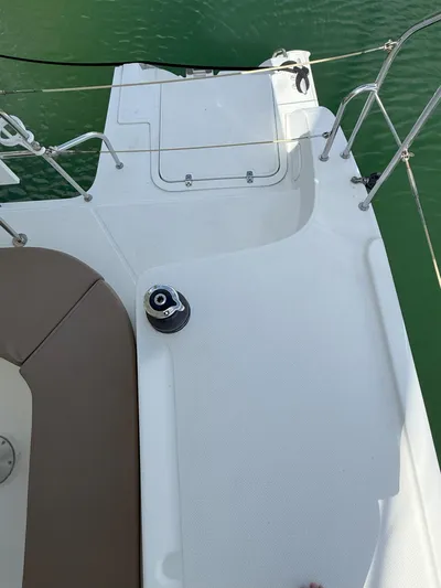 Brake Aweigh Yacht Photos Pics Deck view of 2014 Fountaine Pajot Mahe 36 Evolution catamaran, featuring sleek design and winch.