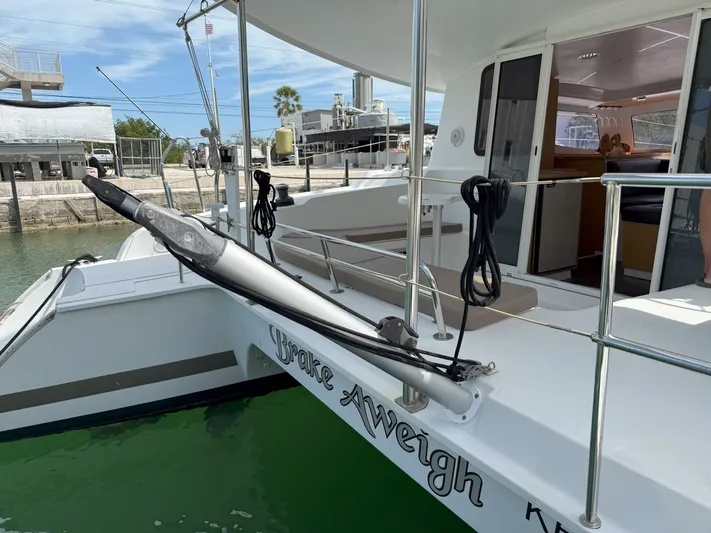 Brake Aweigh Yacht Photos Pics 2014 Fountaine Pajot Mahe 36 Evolution catamaran docked, featuring spacious deck and modern design.