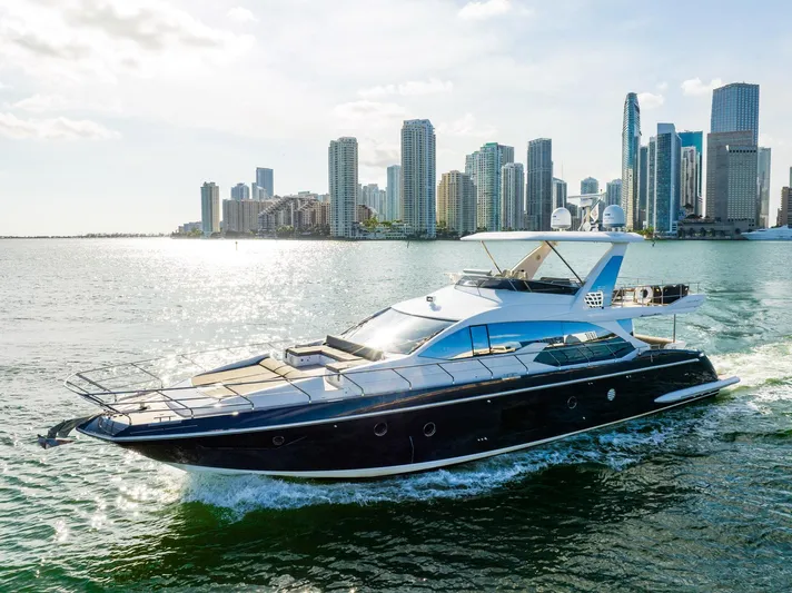 Amici Yacht Photos Pics Azimut 66 yacht cruising near city skyline, 2017 model.