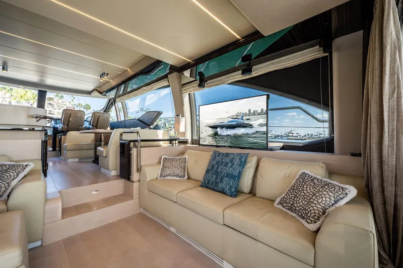 Amici Yacht Photos Pics Luxurious interior of 2017 Azimut 66 yacht with elegant seating and panoramic windows.