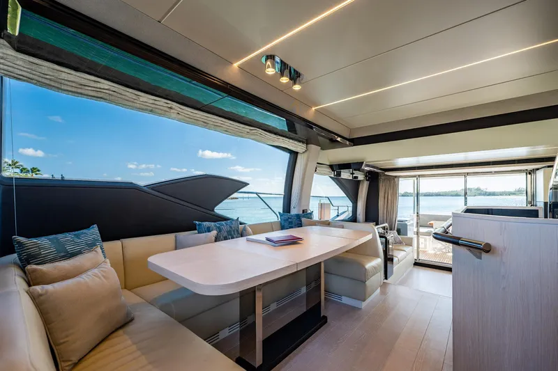 Amici Yacht Photos Pics Luxurious interior of 2017 Azimut 66 yacht with elegant seating and ocean view.