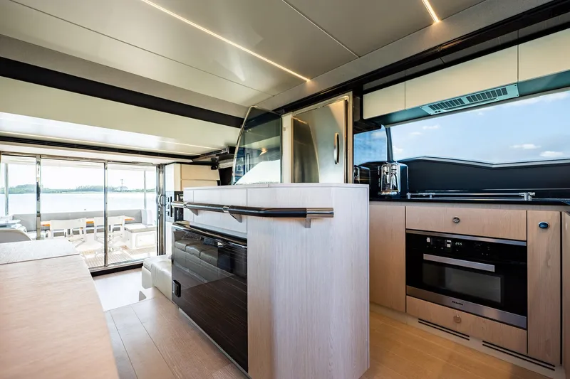 Amici Yacht Photos Pics Luxurious interior of 2017 Azimut 66 yacht with modern kitchen and scenic views.
