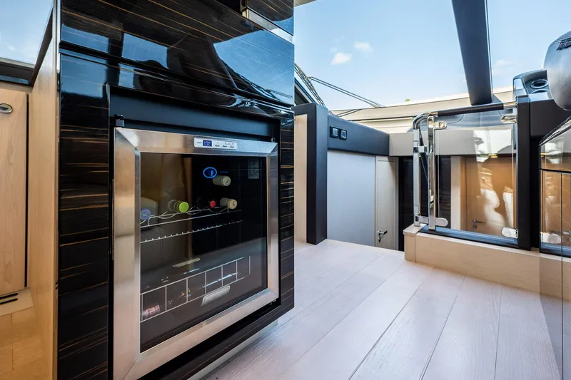 Amici Yacht Photos Pics Luxurious interior of 2017 Azimut 66 yacht featuring a modern kitchen area.